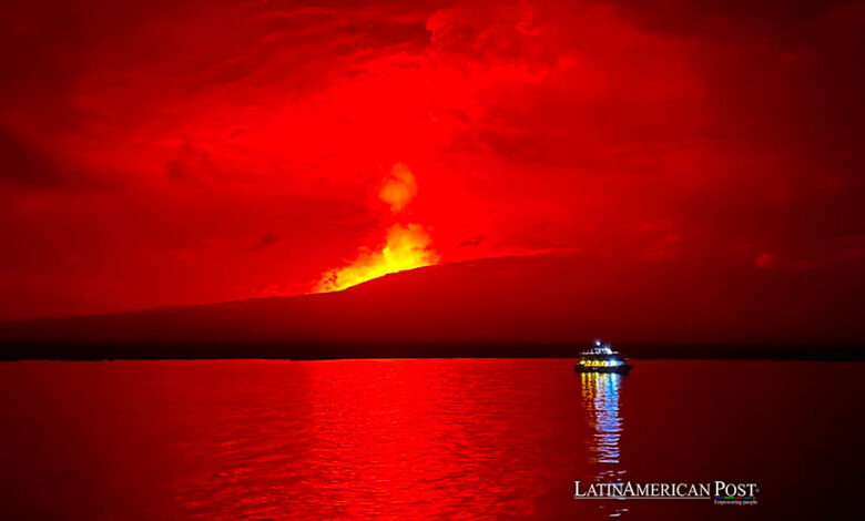 A handout photo made available by Parque Nacional Galapagos shows the eruption of La Cumbre volcano on Fernandina Island