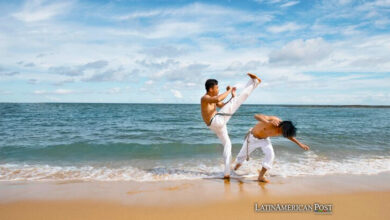 Two men practicing capoeira