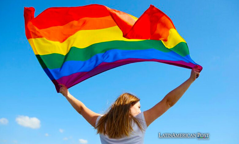 Woman holding a rainbow flag