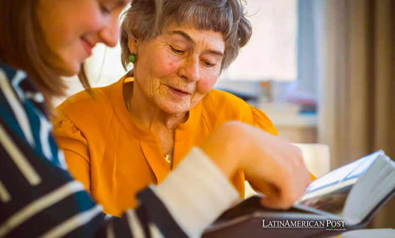 Grandmother and her young granddaughter spent great time together, family members look at photos from the youth of an elderly parent, through the pages of the album and recall funny stories from life.